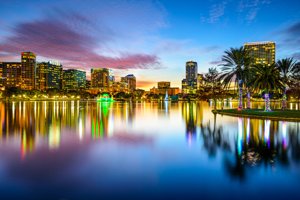 Orlando, Florida, USA downtown city skyline on Eola Lake. Orlando, Florida, USA downtown city skyline on Eola Lake.